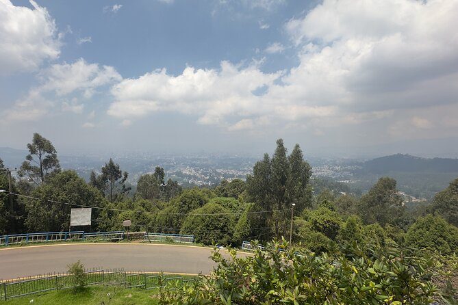 Wooded slopes above Addis Ababa with the city spreading across the plain below